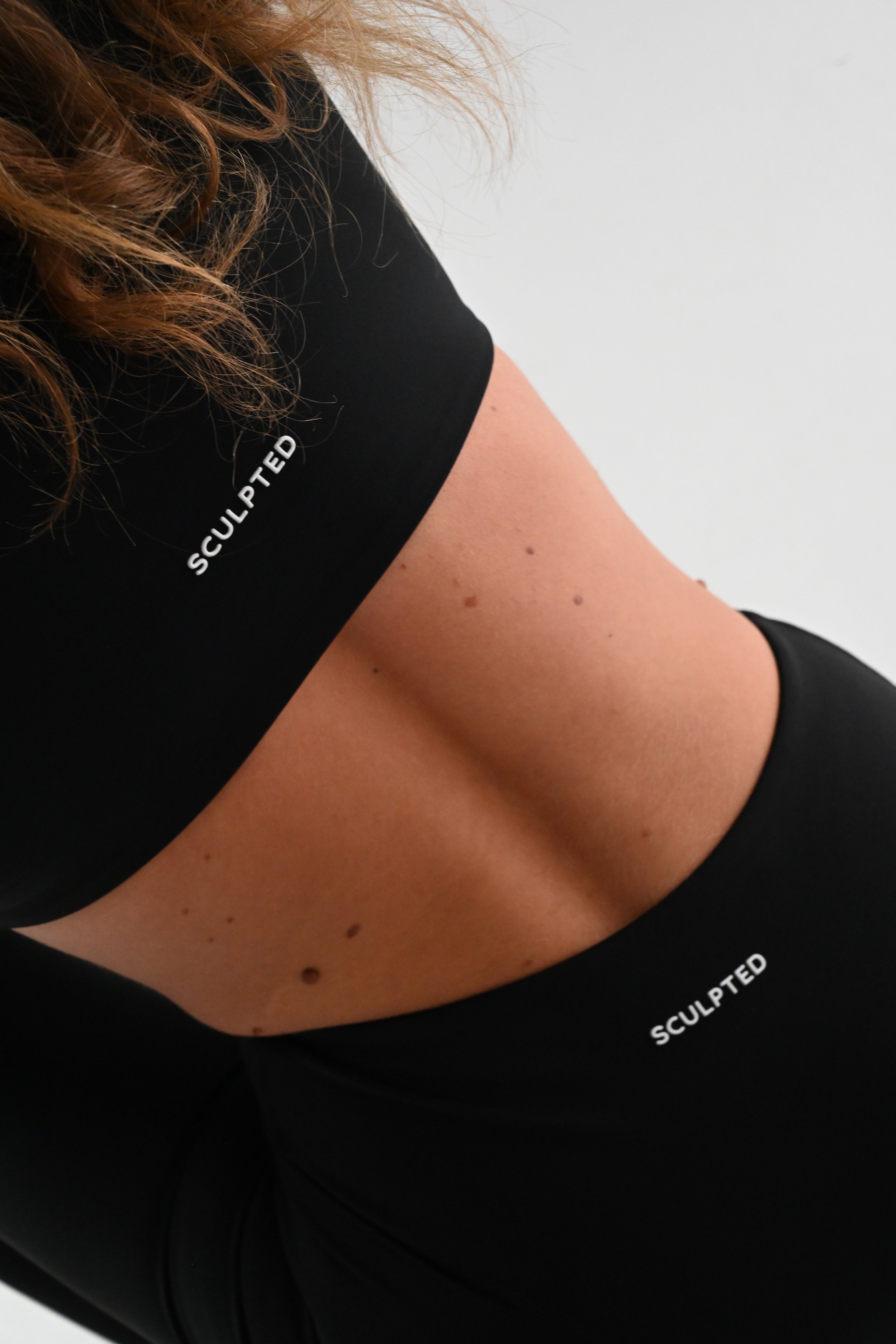 Sculpted Long Sleeve Bra in Black